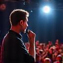Comedian on stage performing stand-up